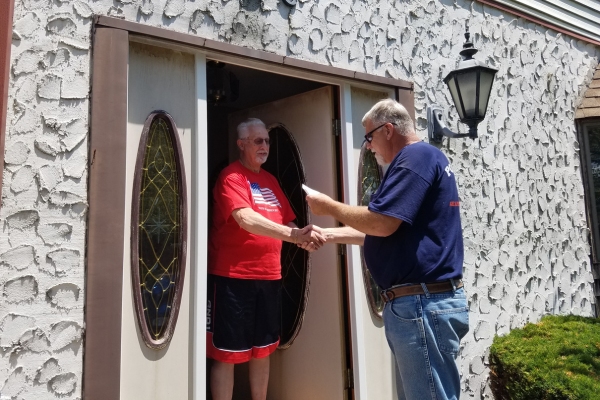Point Bay Fuel technician greeting homeowner during an in-home service