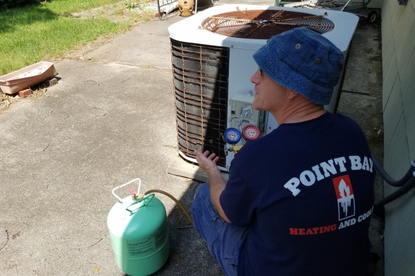 Point Bay Fuel technician performing HVAC maintenance