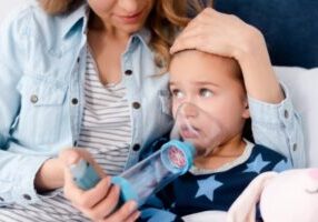 mom assisting child with asthma depicting air quality issues when using air conditioner