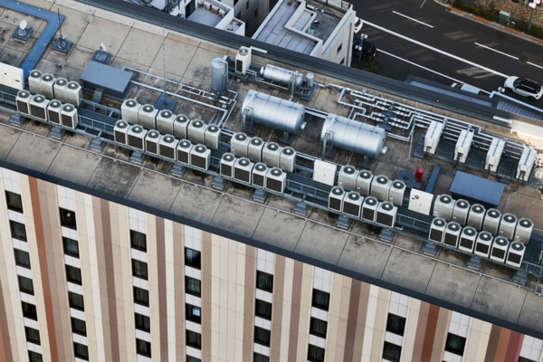 building roof deck with air conditioner outdoor units showing cooling systems integrated into architectural design