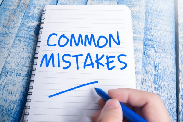 common mistakes handwritten on a notebook using blue marker depicting ac unit