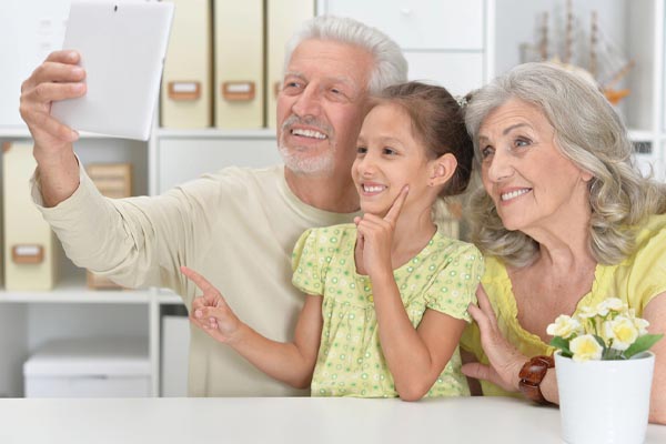 elderly and grandchild enjoying modern cooling system